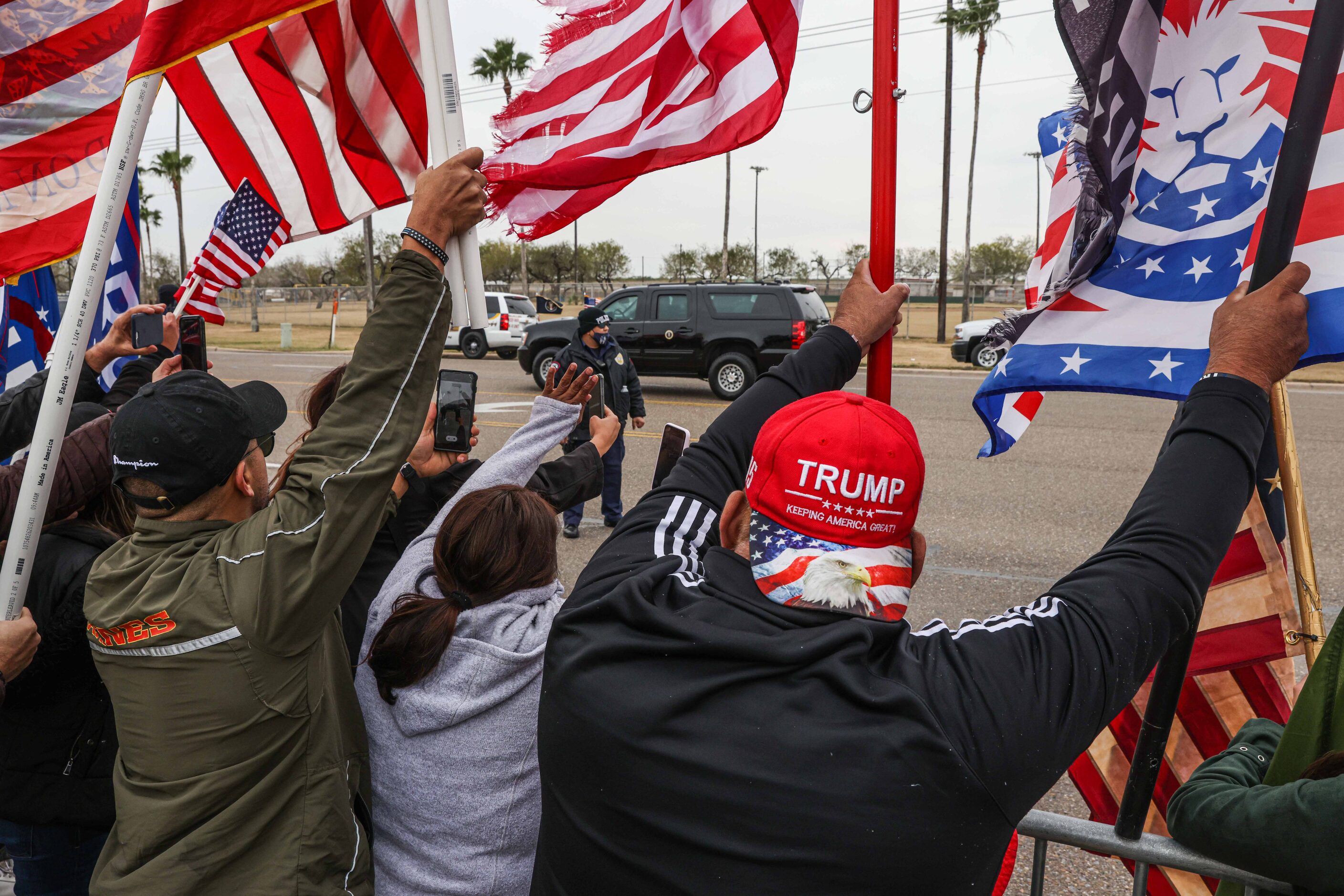 President Donald Trump motor arcade passes in front of the rally in support as he visit part...