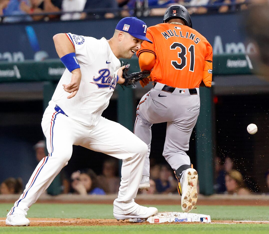 Baltimore Orioles batter Cedric Mullins (31) is safe at first after Texas Rangers first base...