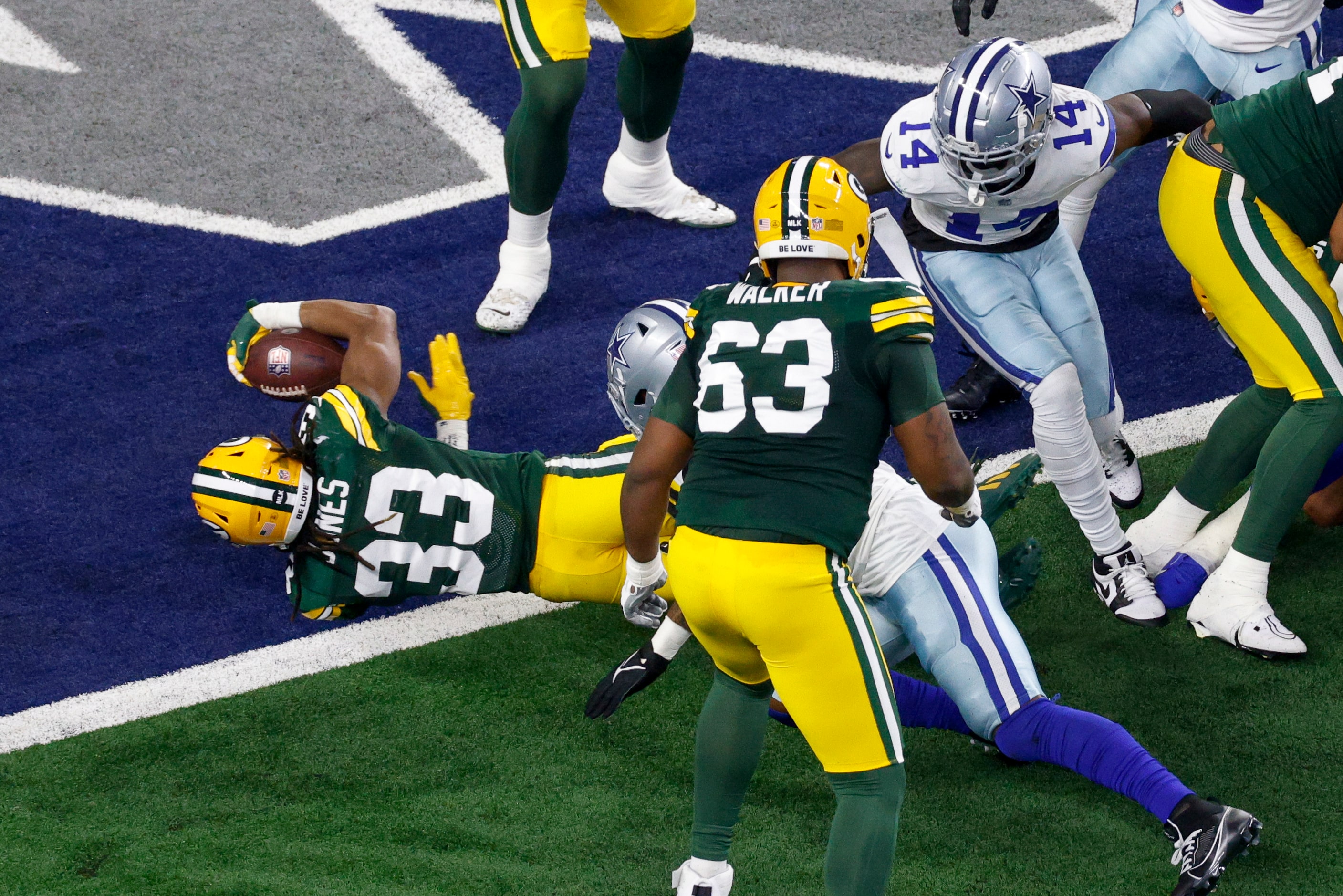 Green Bay Packers running back Aaron Jones (33) rushes for a touchdown during the first half...