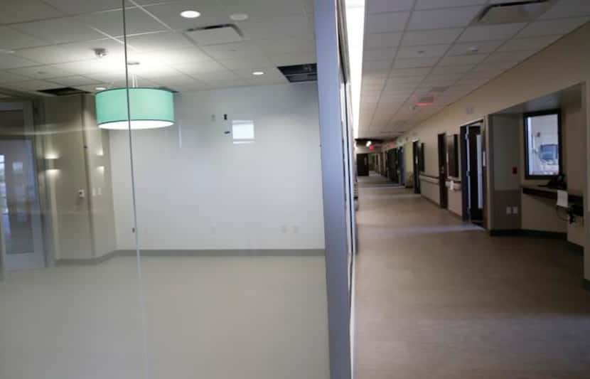 
A new care team room (left) for the doctors and nurses is located near patient rooms at the...