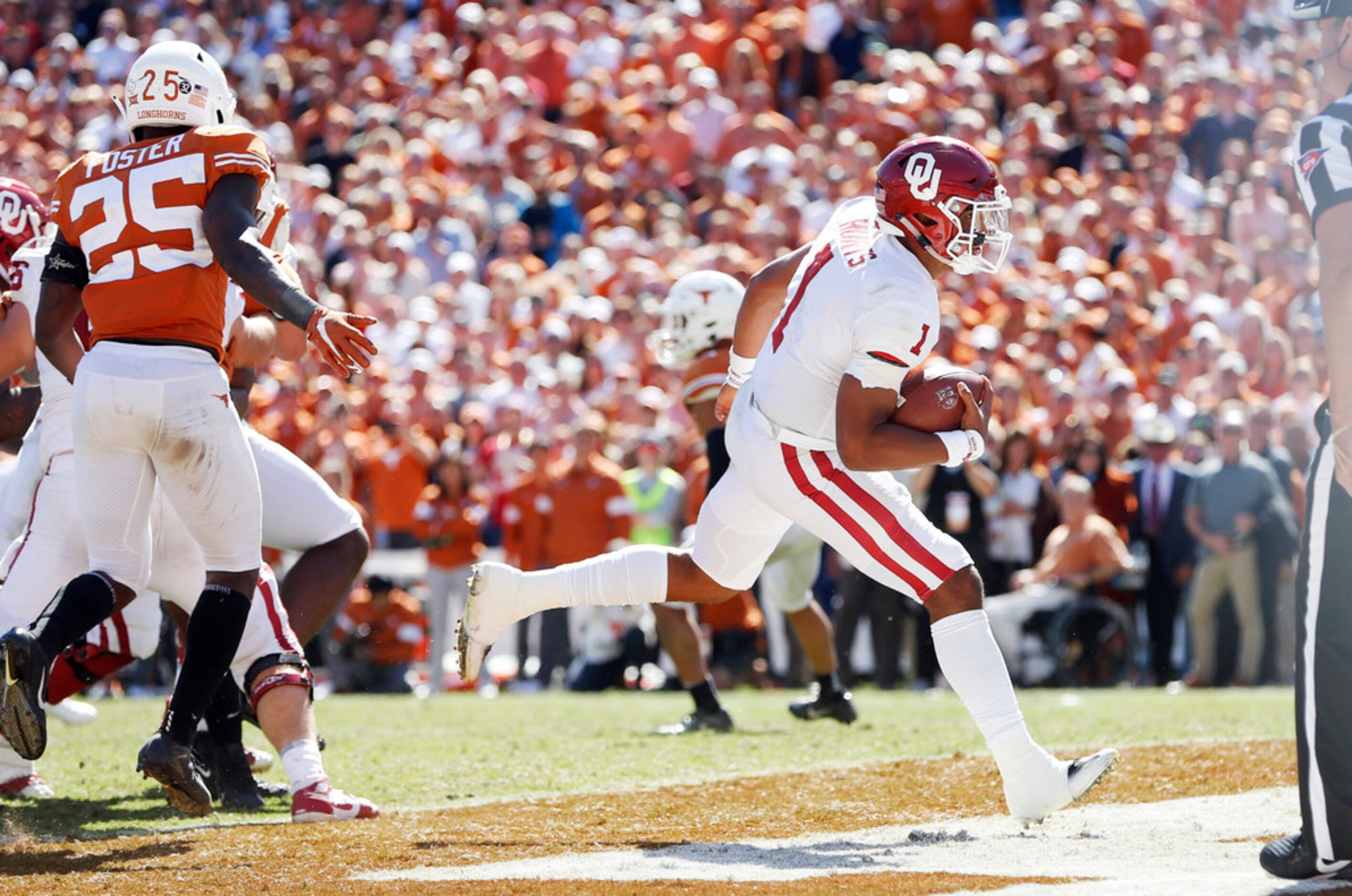 Oklahoma Sooners quarterback Jalen Hurts (1) scores a touchdown as Texas Longhorns defensive...