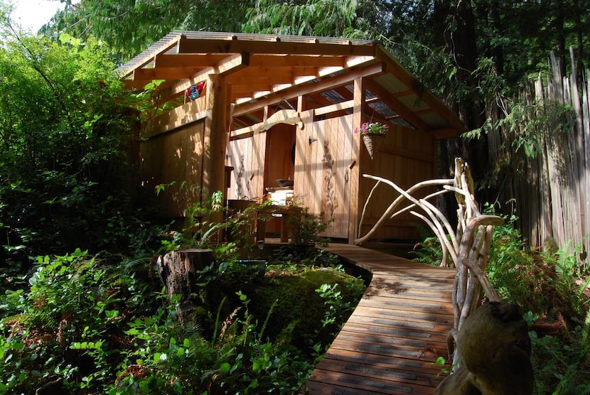 The base camp’s  spalike   shower house was built from cedar harvested from the island.