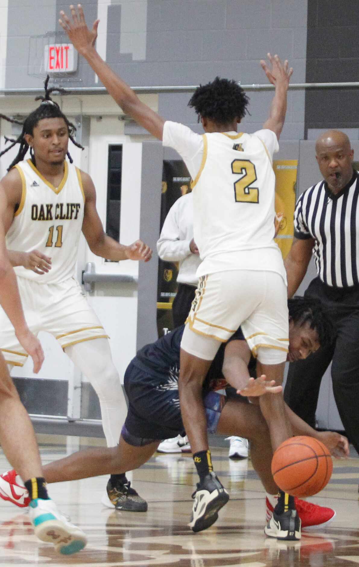 Kimball's Damarion Wickware-Wesley (24) background, attempts to recover a loose ball around...