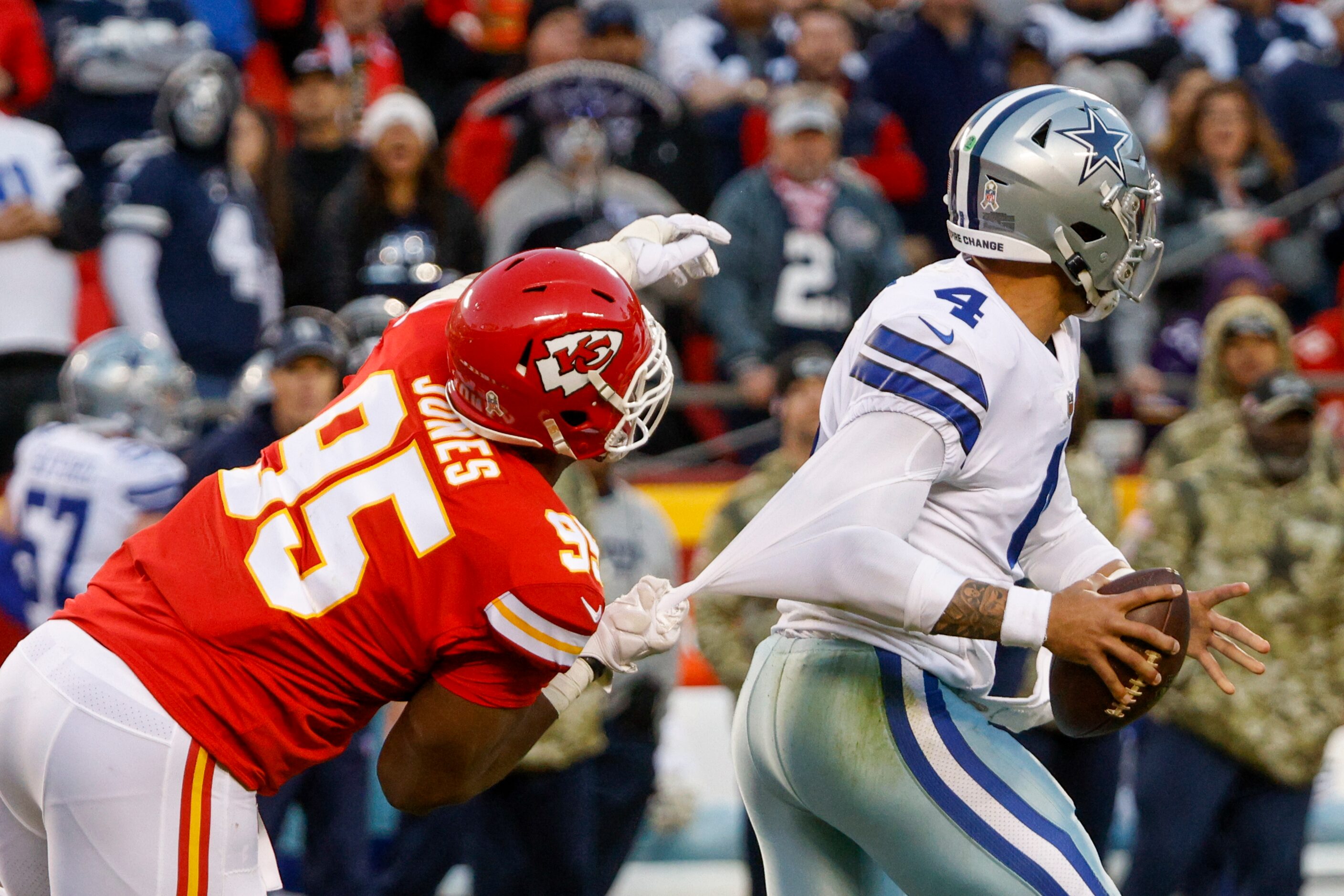 Kansas City Chiefs defensive end Chris Jones (95) pulls down Dallas Cowboys quarterback Dak...