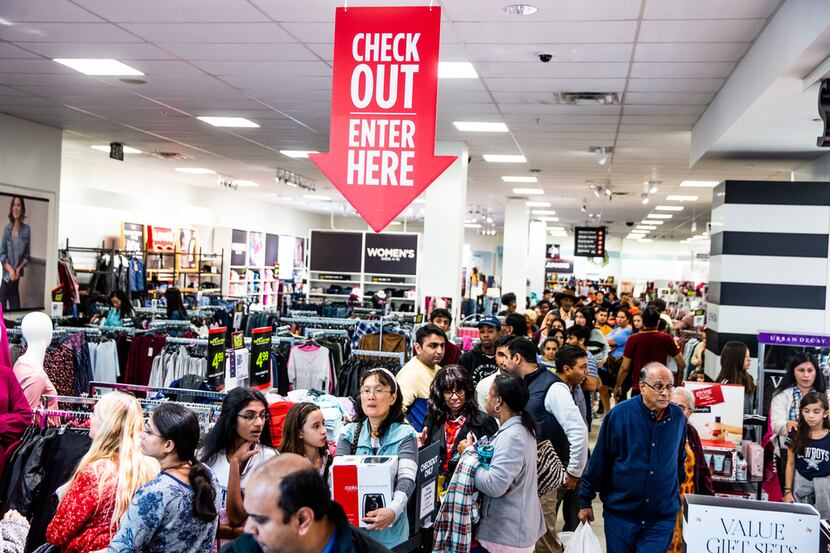 Costumers line up to check out during Black Friday shopping at J.C. Penney in Fairview on...