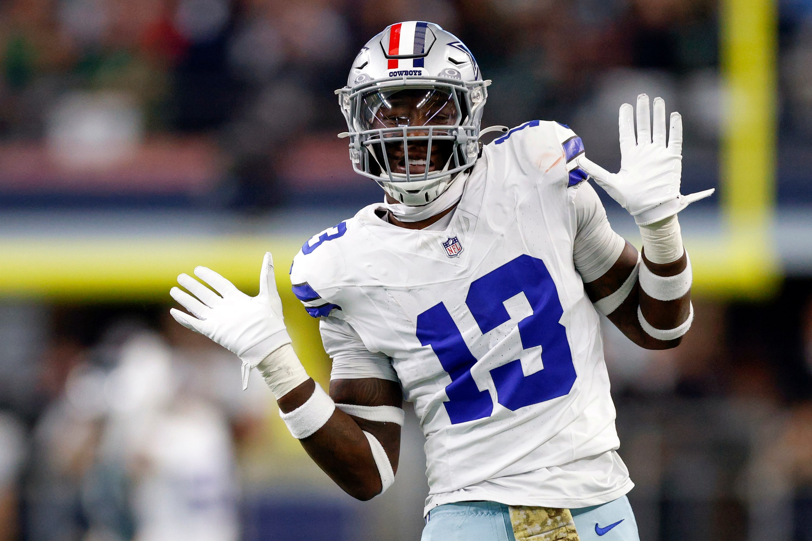 Dallas Cowboys linebacker DeMarvion Overshown (13) celebrates after sacking Philadelphia...