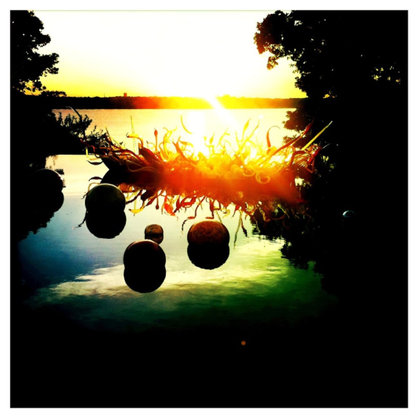 Chihuly's Carnival Boat is seen at dusk at the Dallas Arboretum. Photographed with an iPhone...