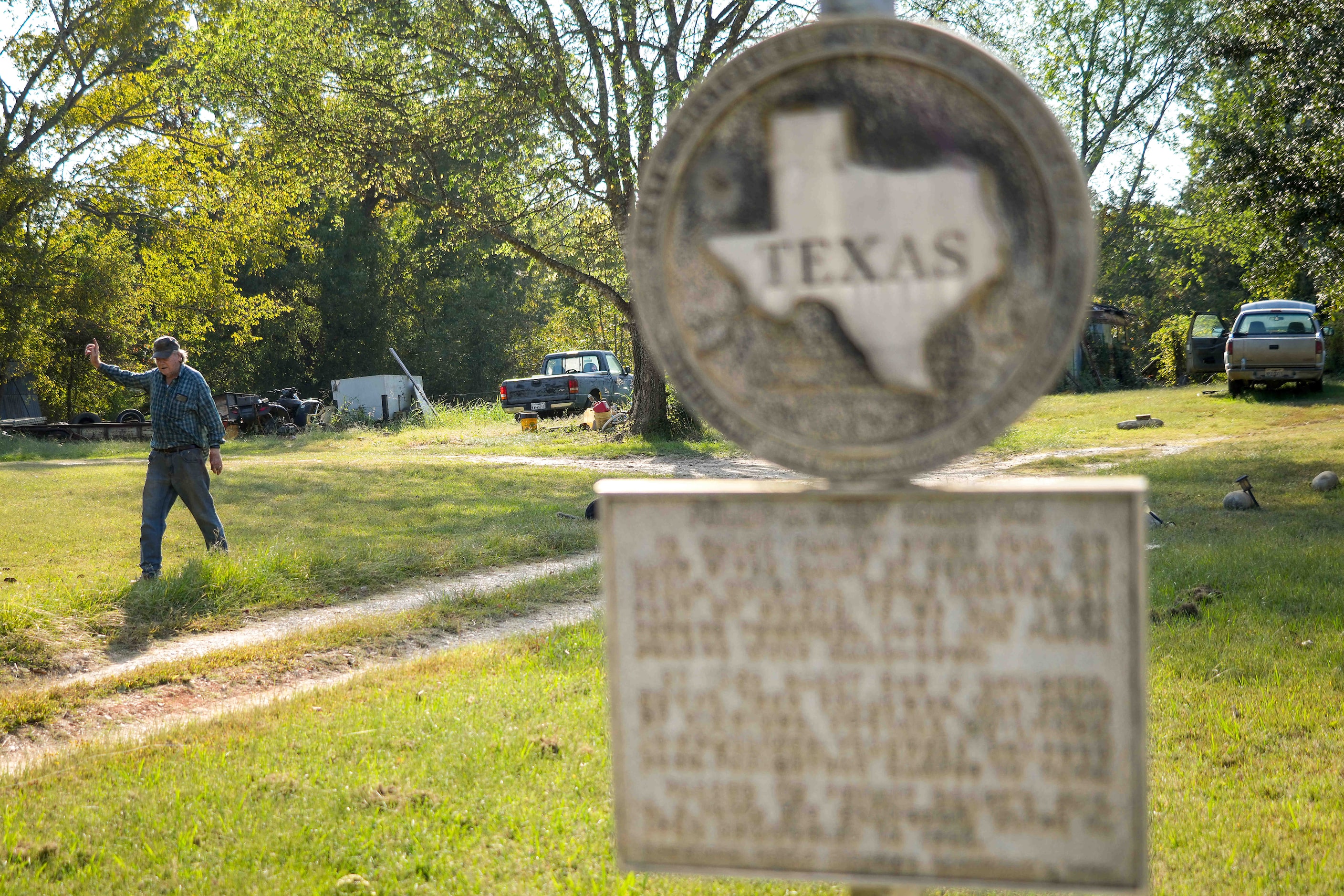 Behind a Texas Historical marker noting the log cabin built by his family at the site in...