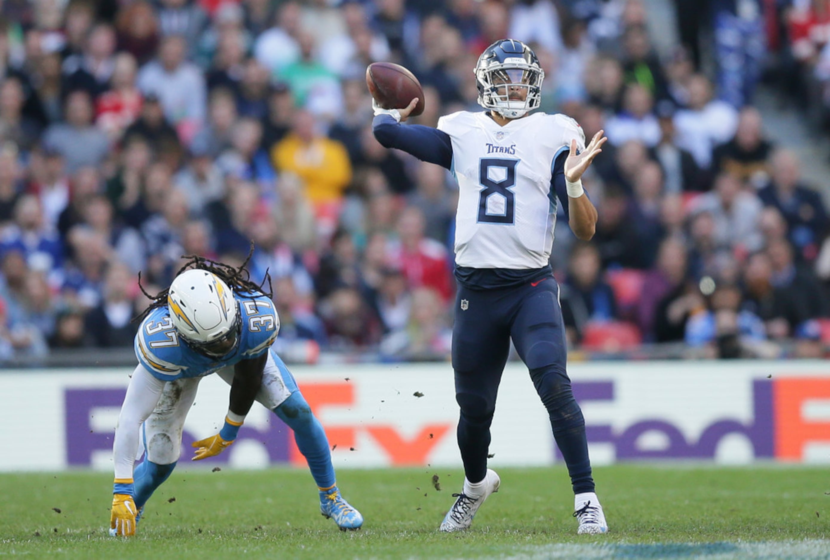 November 05, 2018:.Tennessee Titans quarterback Marcus Mariota (8)  scrambles for a first down during an NFL football game between the Tennessee  Titans and Dallas Cowboys at AT&T Stadium in Arlington, Texas. Manny