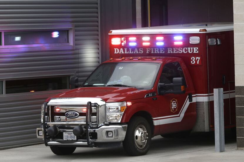An ambulance pulls into the Dallas Fire-Rescue station 37 in Dallas in 2014.  (AP Photo/LM...