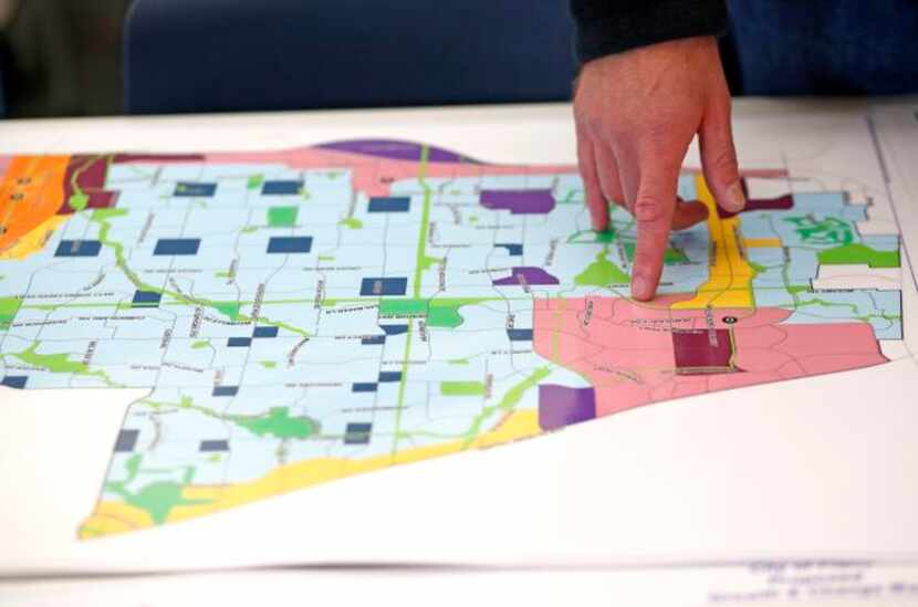 
A resident looks at a map depicting the new “Plano Tomorrow” comprehesive plan on the...