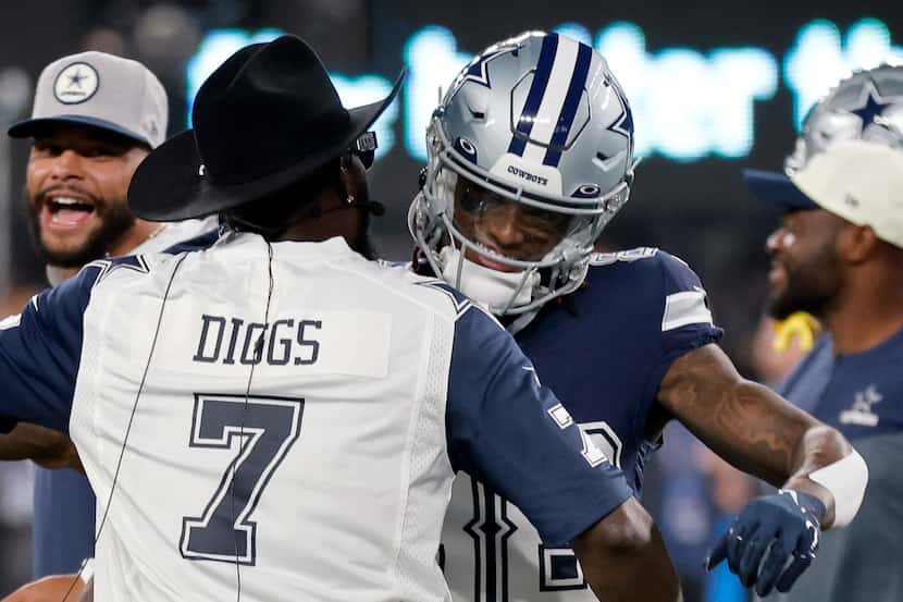 Dallas Cowboys wide receiver CeeDee Lamb (88) is greeted by former Cowboy Dez Beyant during...
