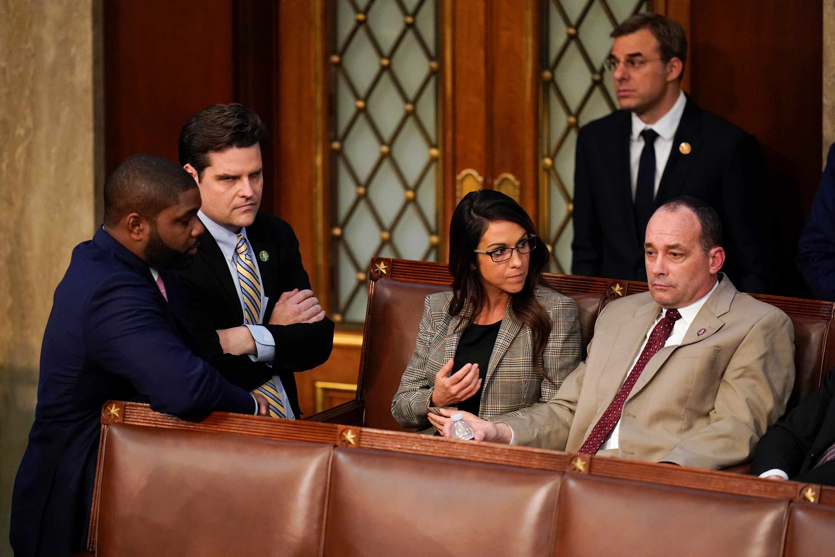 Lawmakers talk during the tenth round of voting in the House chamber as the House meets for...
