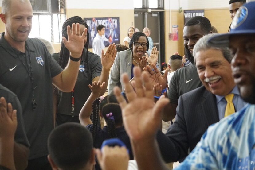 Dallas Mavericks CEO Cynthia Marshall and DISD Superintendent Michael Hinojosa celebrate the...