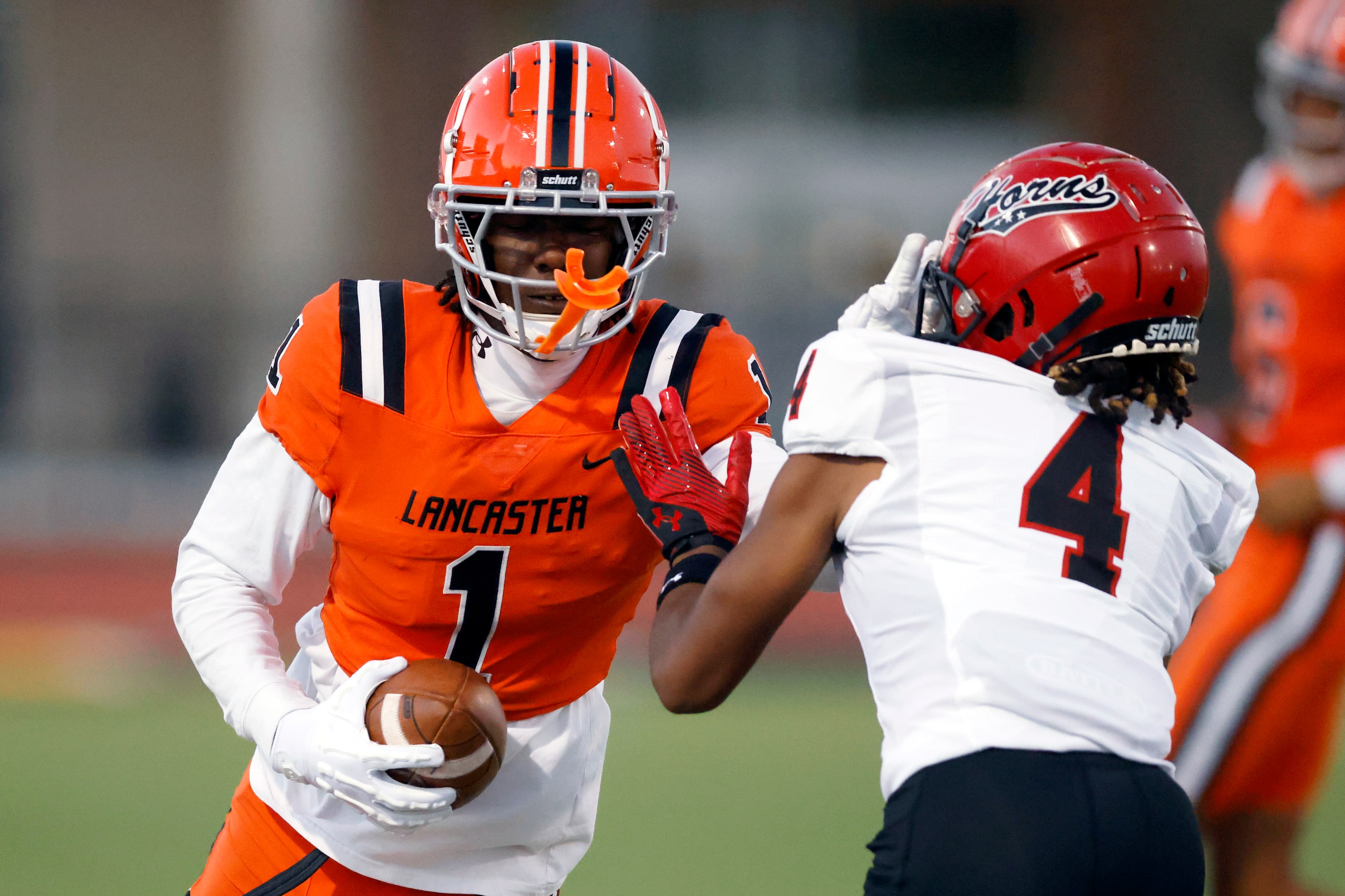 Cedar Hill defensive back Khorey Stoves (4) forces Lancaster wide receiver Emmanuel Choice...