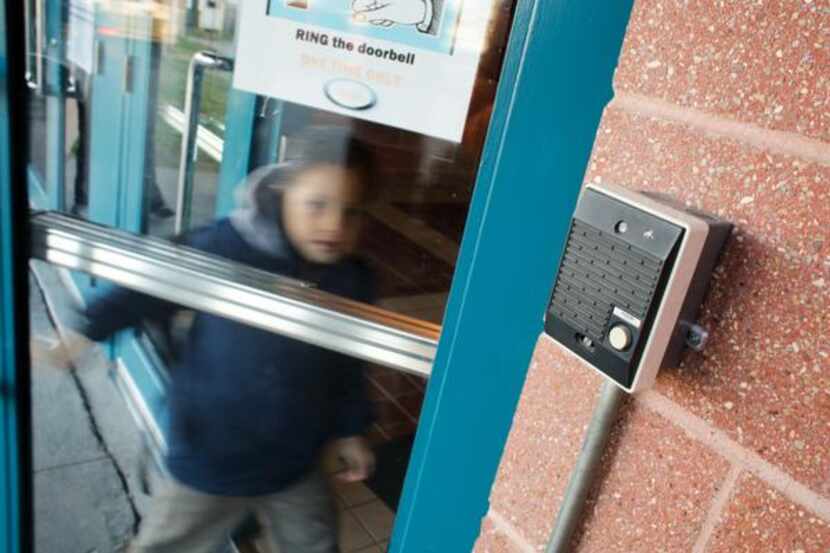 
A student passes through a safety-reinforced door at Cesar Chavez Learning Center in...