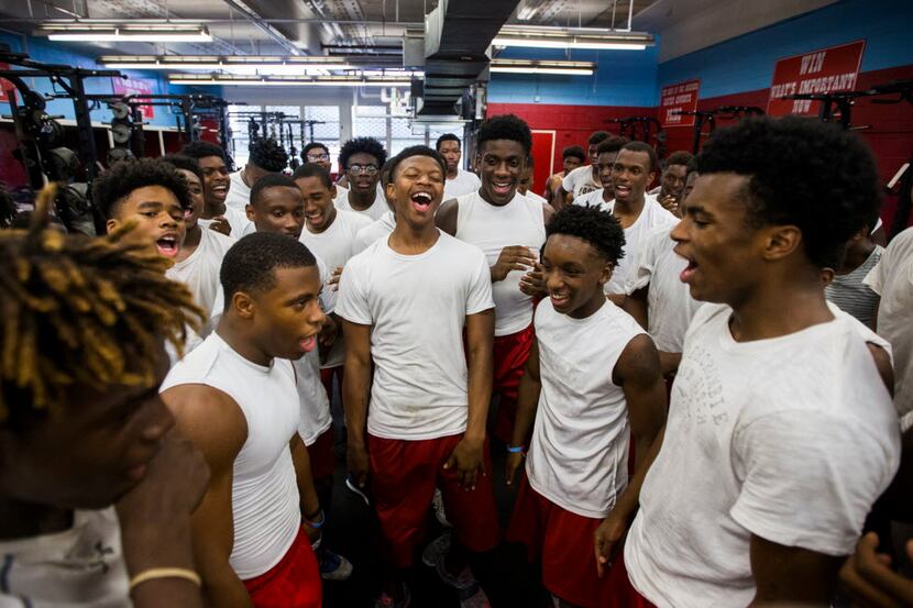 Carter High School offensive football players rally in the weight room on Monday, August 14,...