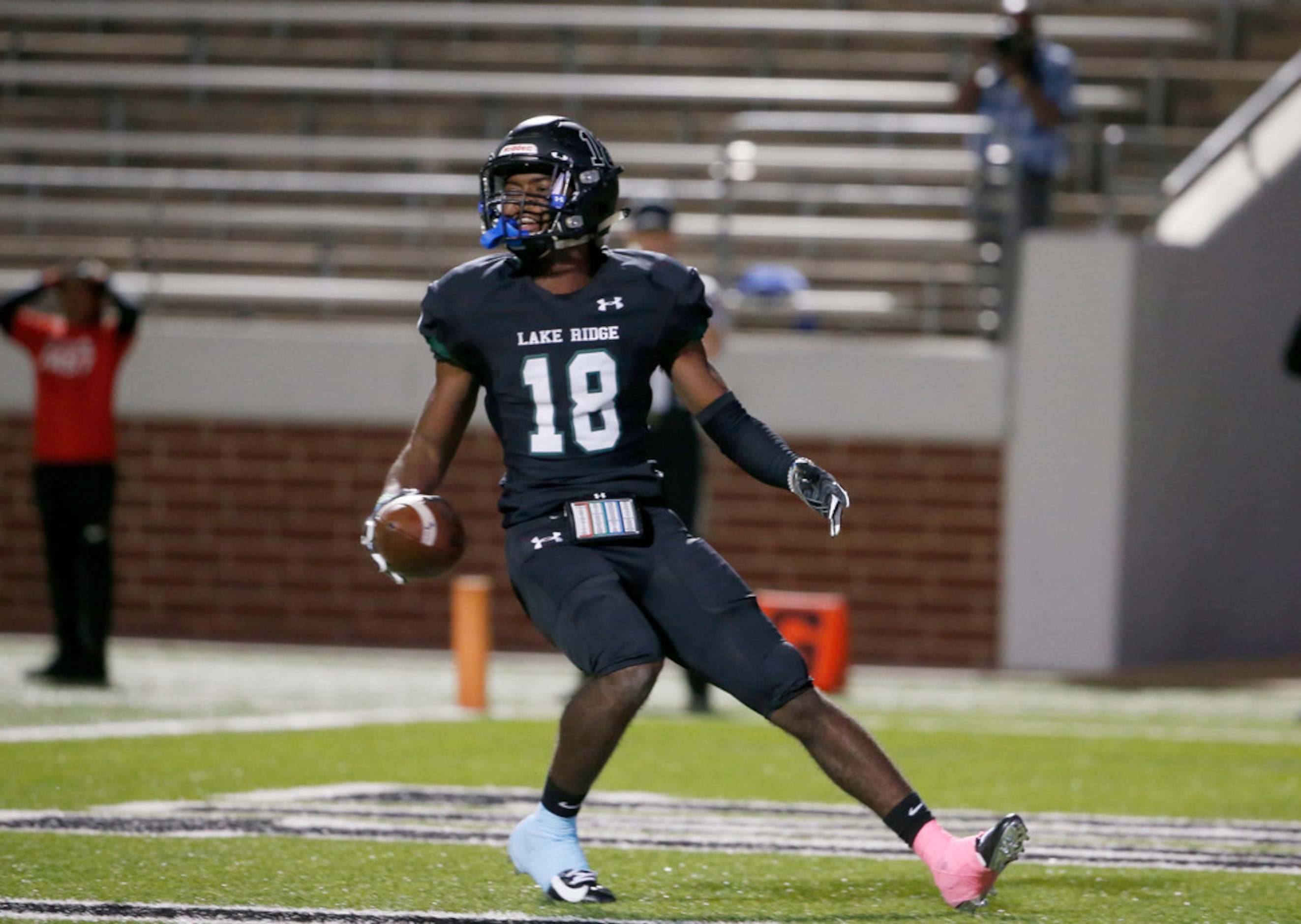 Mansfield Lake Ridge receiver Keylan Johnson (18) celebrates his touchdown against Cedar...