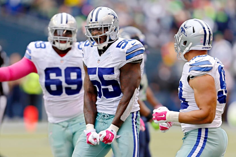 Dallas Cowboys middle linebacker Rolando McClain (55) reacts after intercepting a Seattle...