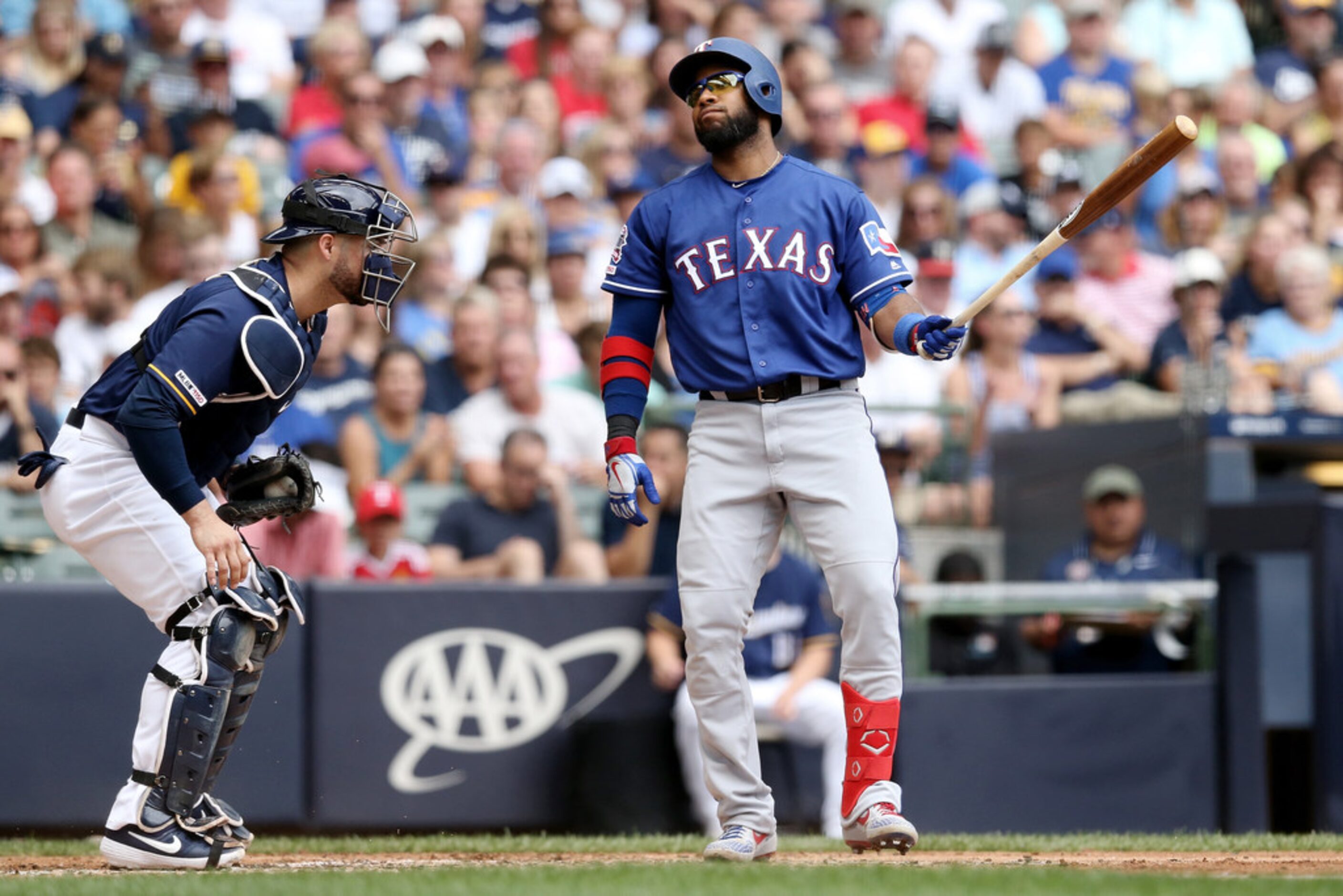 MILWAUKEE, WISCONSIN - AUGUST 11:  Elvis Andrus #1 of the Texas Rangers reacts after...