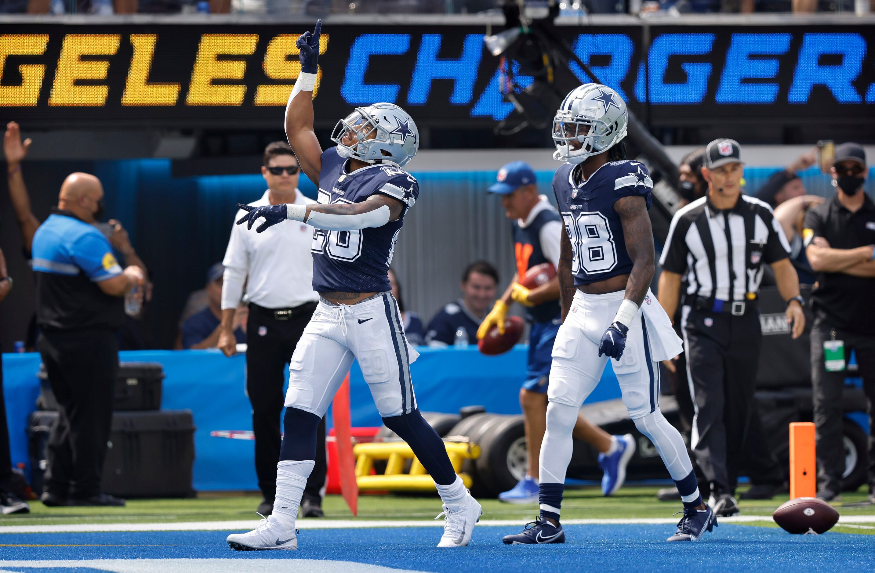 Dallas Cowboys running back Tony Pollard (20) celebrates his first quarter touchdown against...