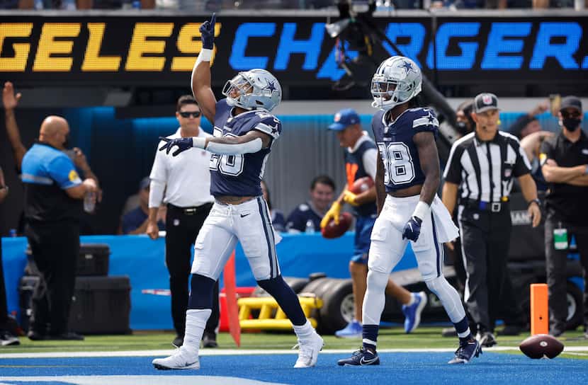 Dallas Cowboys running back Tony Pollard (20) celebrates his first quarter touchdown against...