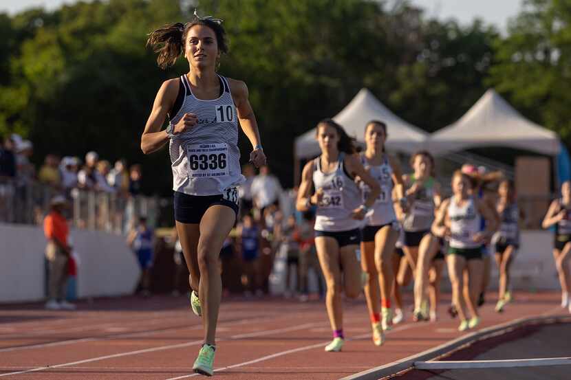 Flower Mound's Natalie Cook leads the girls 1,600-meter race en route to setting a new state...