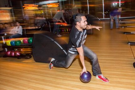 Alex Collazo bowls a strike at Bowl and Barrel.