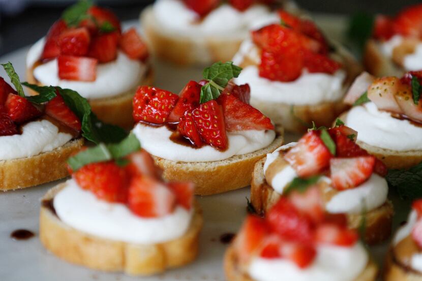 Bread with whipped ricotta cheese, strawberries, balsamic reduction and mint.