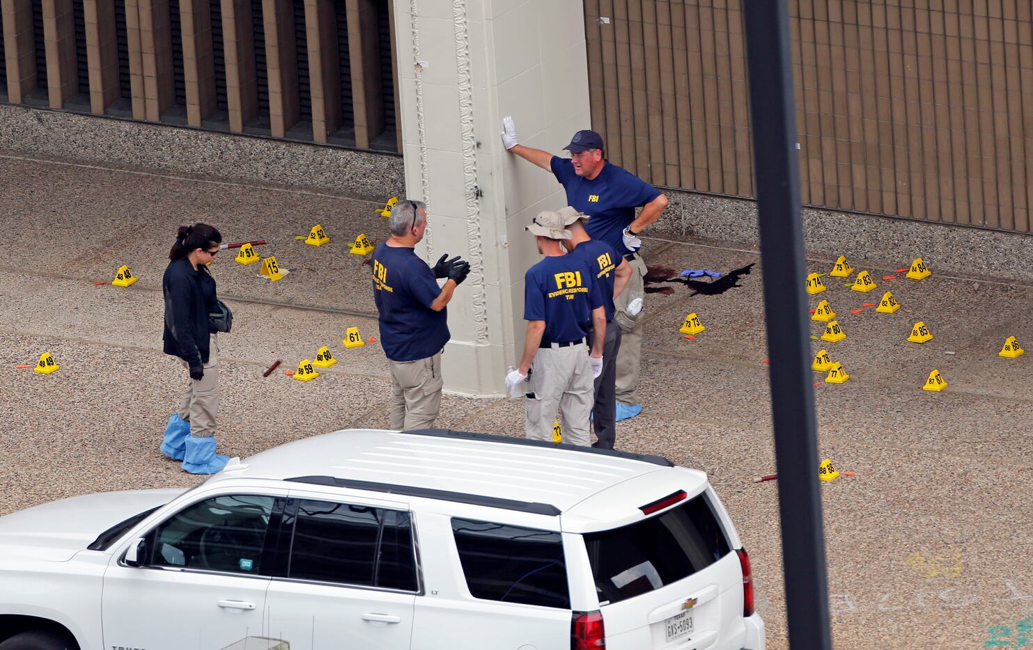 On July 9, two days after the ambush, members of an FBI evidence response team gathered...