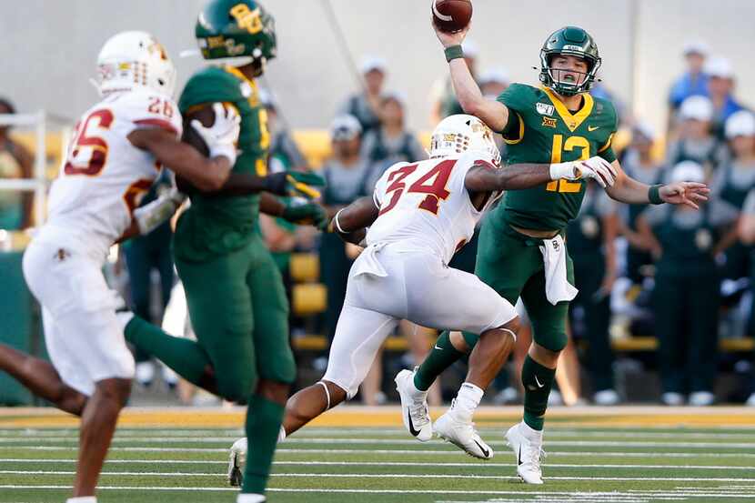 Baylor Bears quarterback Charlie Brewer (12) attempts a pass to Baylor Bears wide receiver...