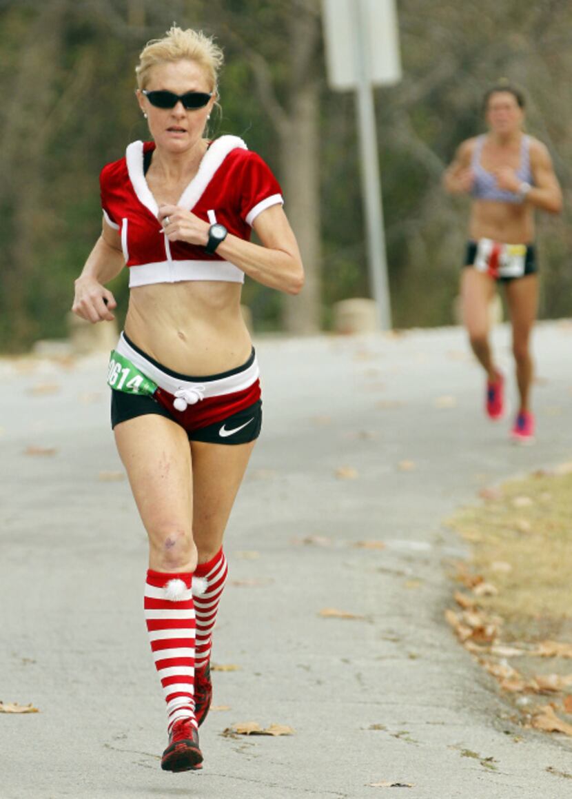A festive runner makes their way through the White Rock Lake portion of the race near the 17...