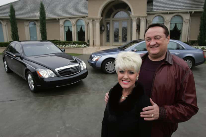 Eric and Christine Brauss are shown with their Maybachs -- $300,000 ultra-luxury cars made...