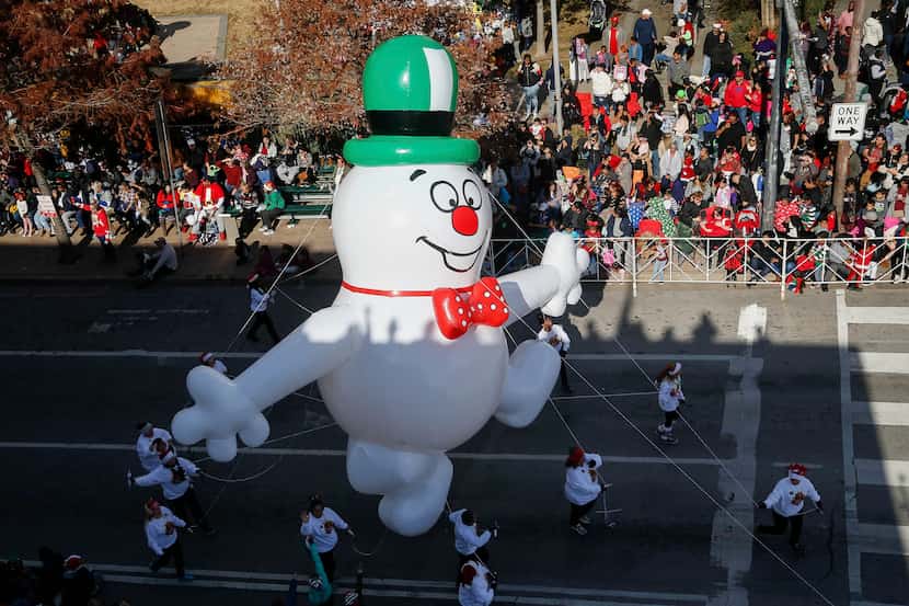 Folks enjoying the annual Dallas Holiday Parade -- including a snowman float -- didn't have...