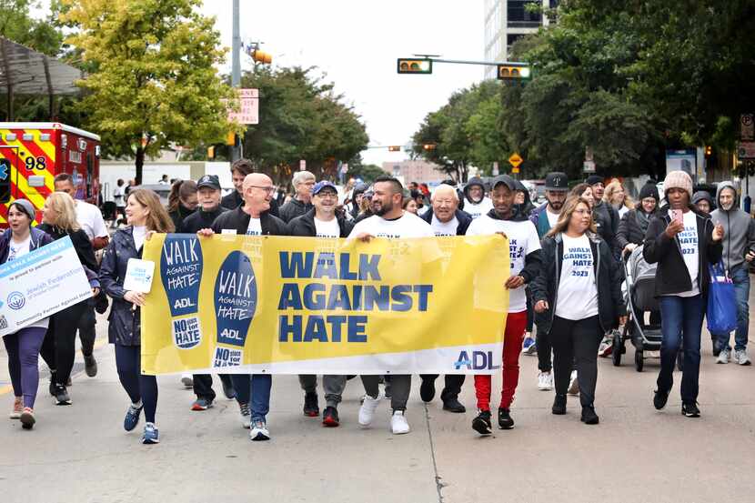 Community members participate in the annual "Walk Against Hate" event at Klyde Warren Park...