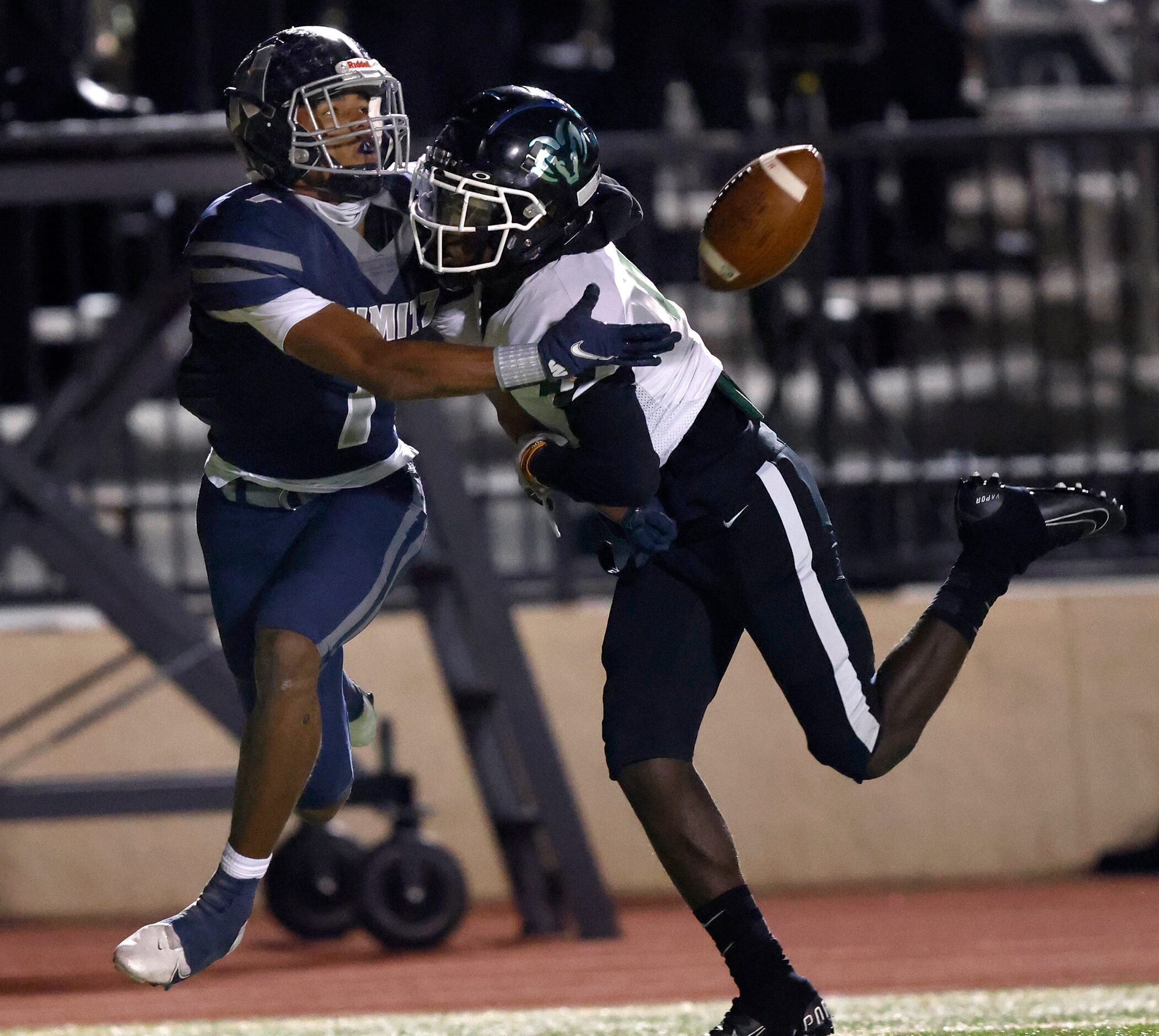 Irving Nimitz receiver Isaiah Gipson (1, left) tries to catch a long pass around Richardson...