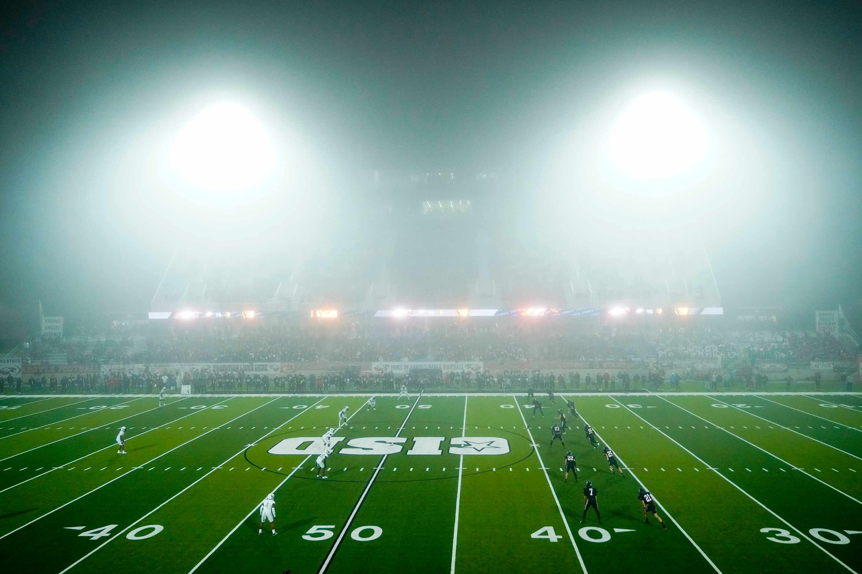 Argyle kicker Carter Buxton (40) kicks of as fog shrouds the stadium during the second half...