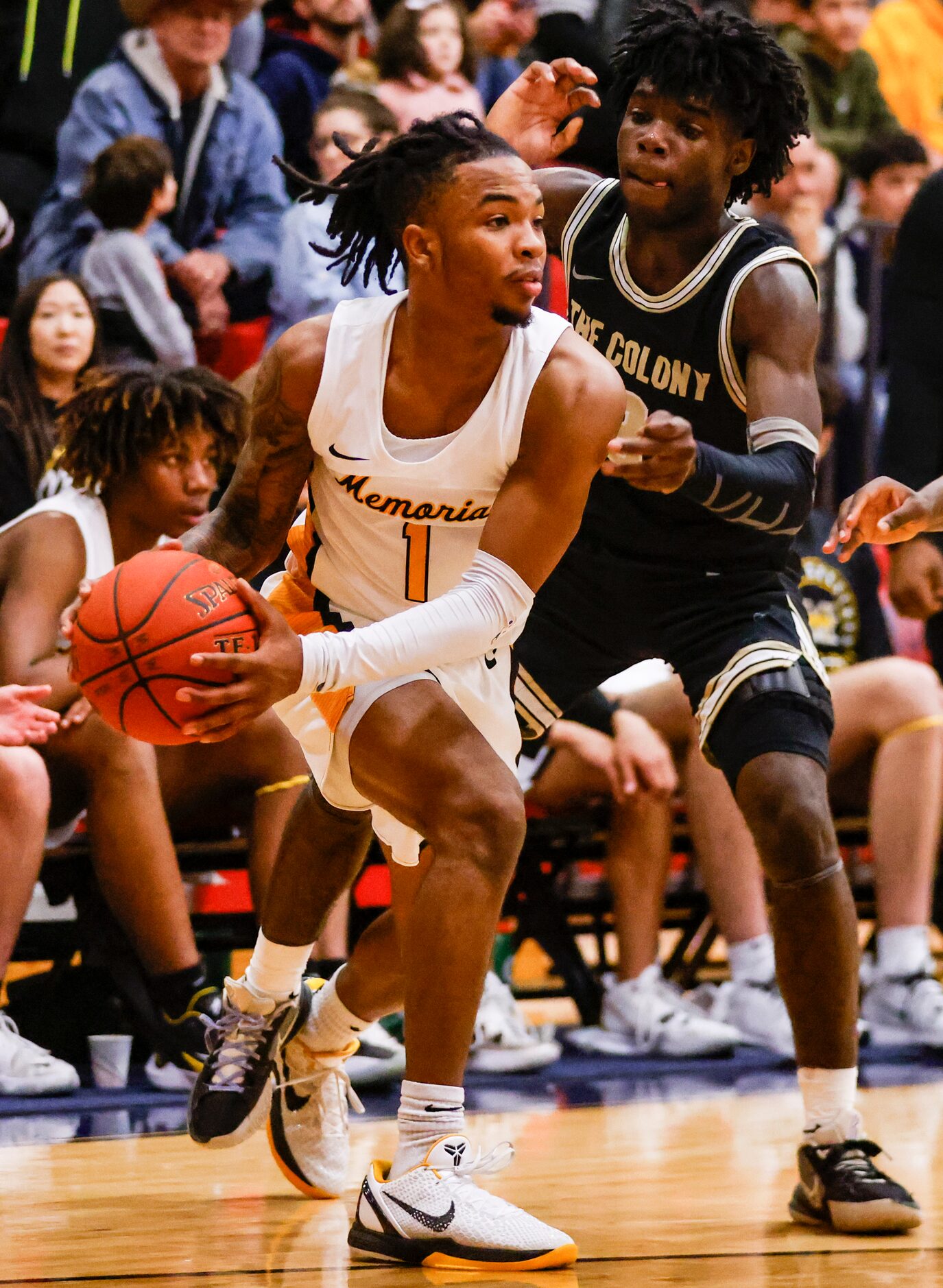 Memorial High School Isaiah Foster (1) looks for a teammate to pass the ball to as The...