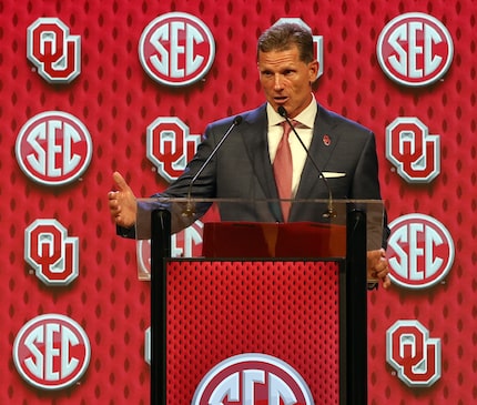 Oklahoma head football coach Brent Venables answers the question of a media member during...