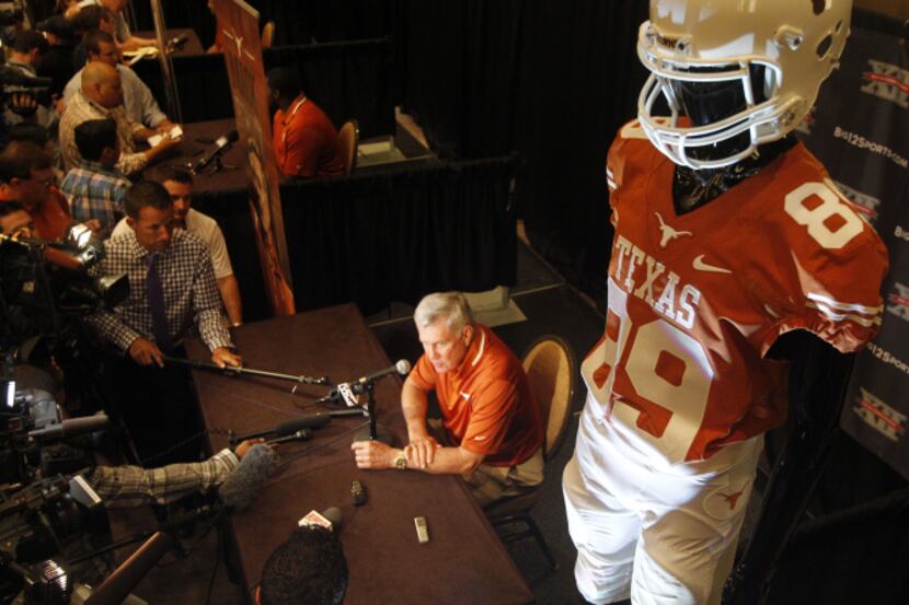 Texas coach Mack Brown talks to the media during the Big 12 media days at the Omni Hotel in...