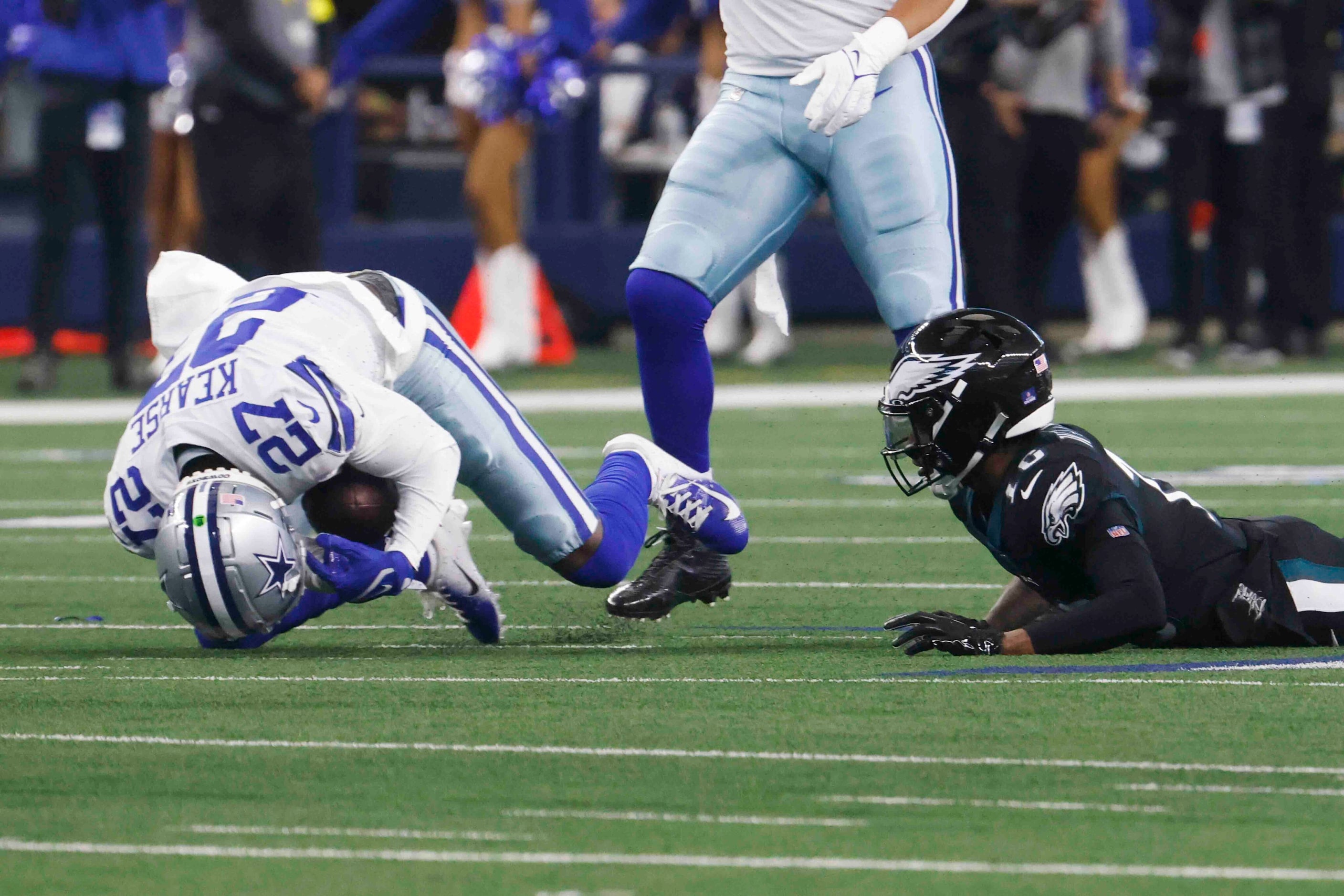 Dallas Cowboys safety Jayron Kearse (27), left, intercepts the ball past Philadelphia Eagles...