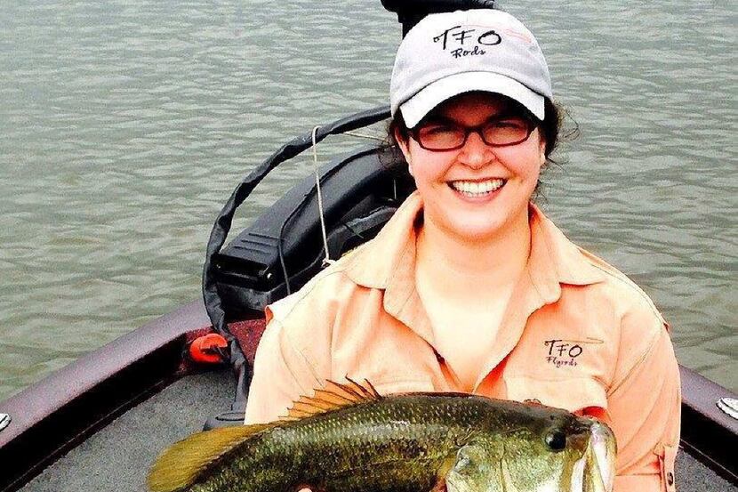 Kimberly Penick caught this 21- inch largemouth bass on a fly. It s her personal best....
