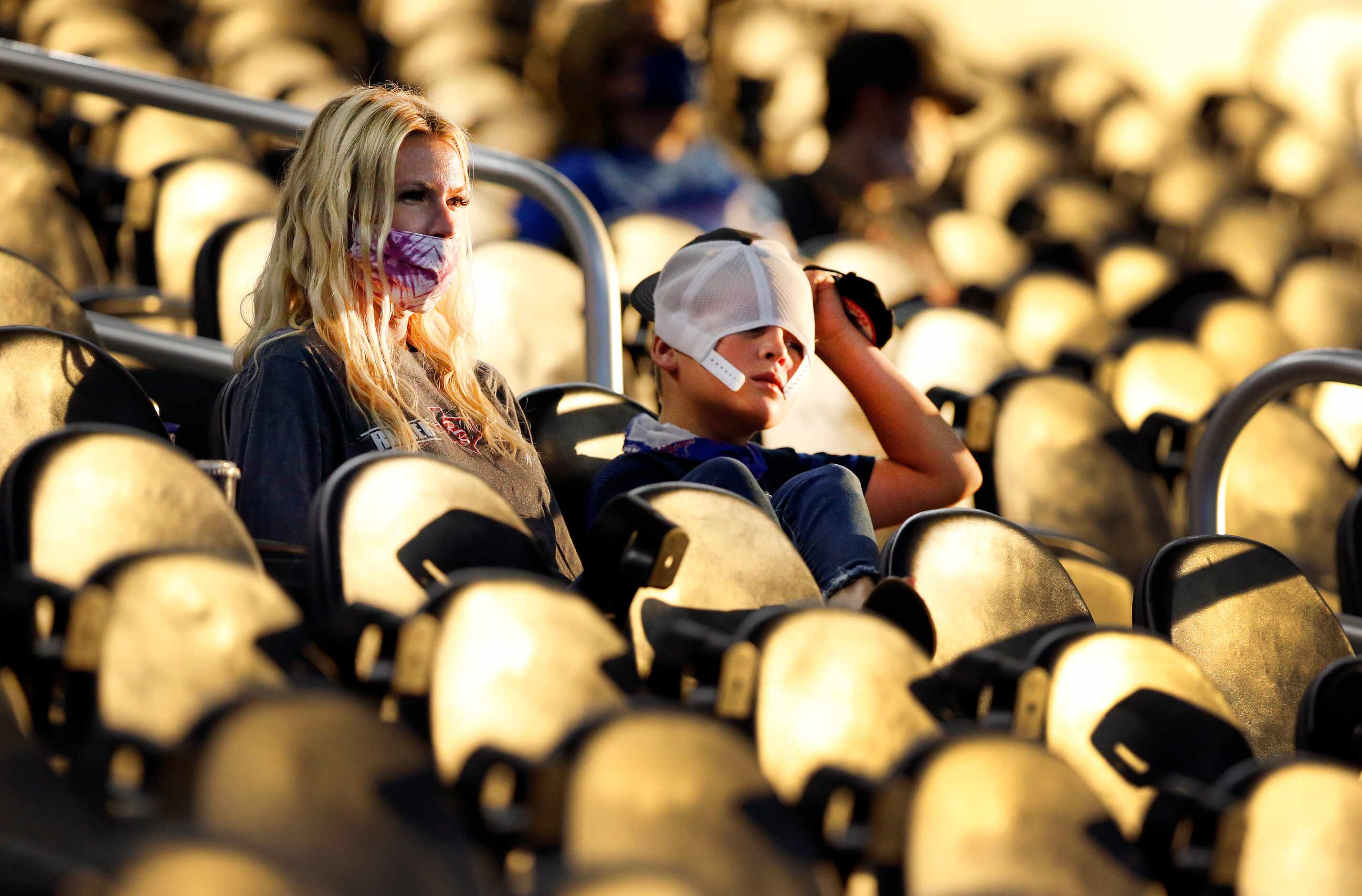 Denton Ryan fans watch as their team runs away with a big win against Arlington Martin...