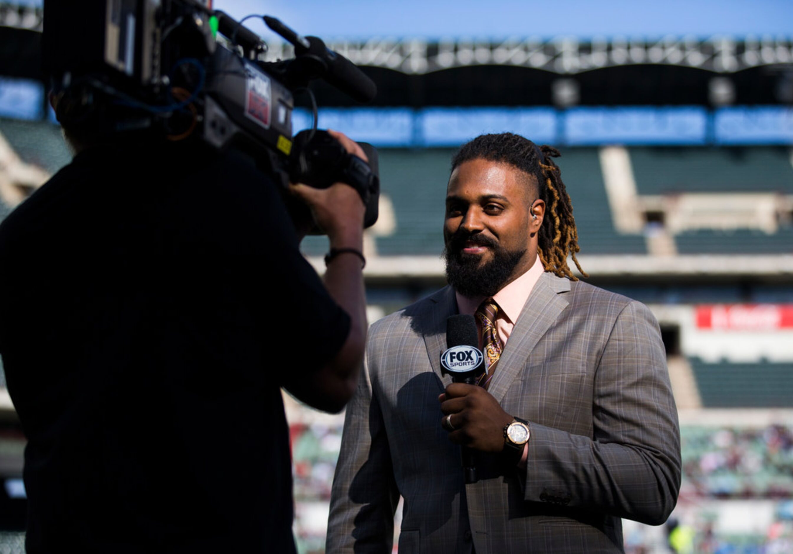 FOX Sports sideline reporter and New Orleans Saints defensive end Cam Jordan talks on camera...