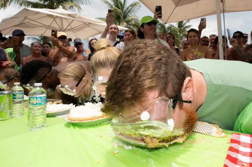 In this photo provided by the Florida Keys News Bureau, Joshua Mogle, right, of Altoona,...