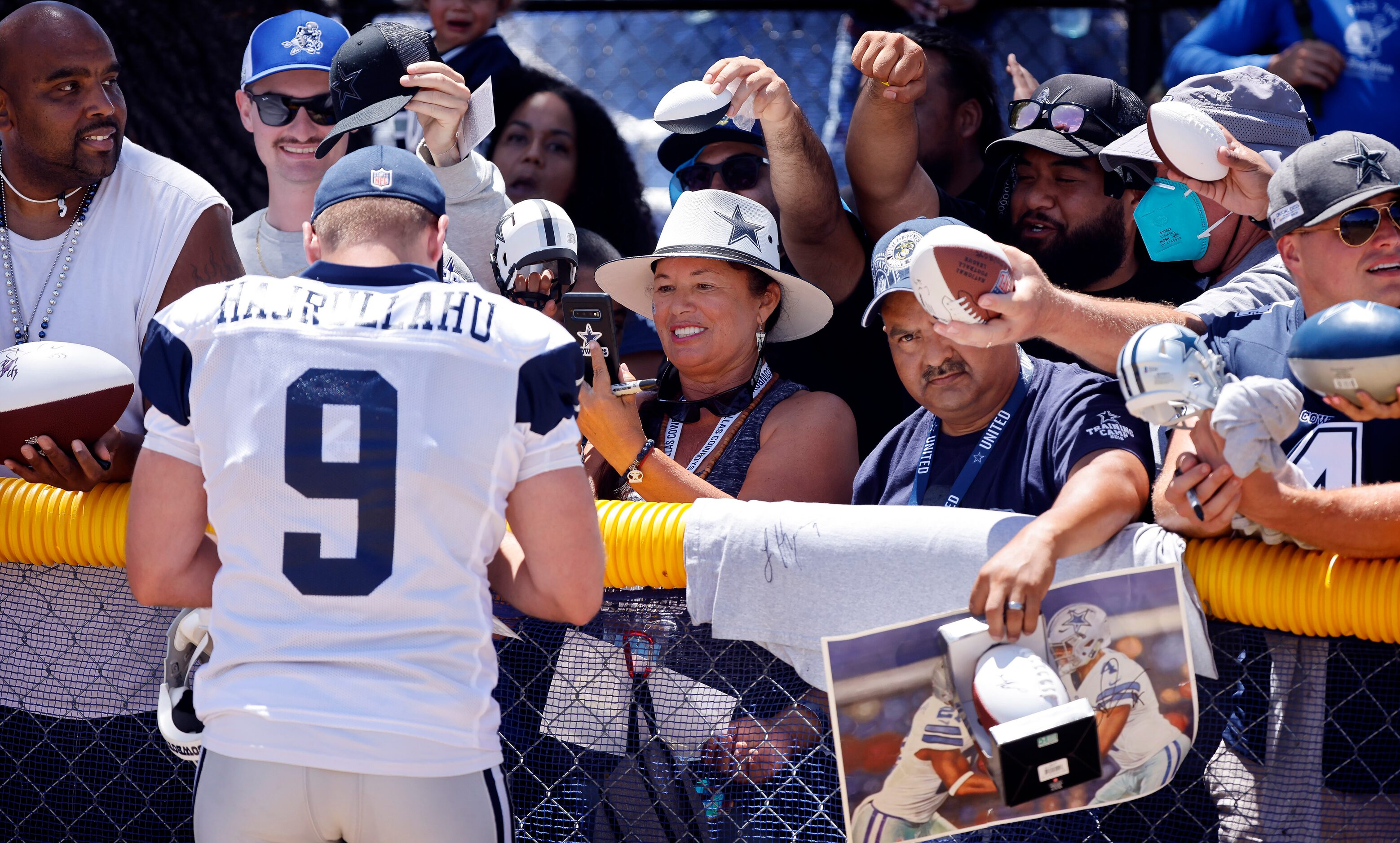 Dallas Cowboys kicker Lirim Hajrullahu (9) signs autographs for fans following training camp...