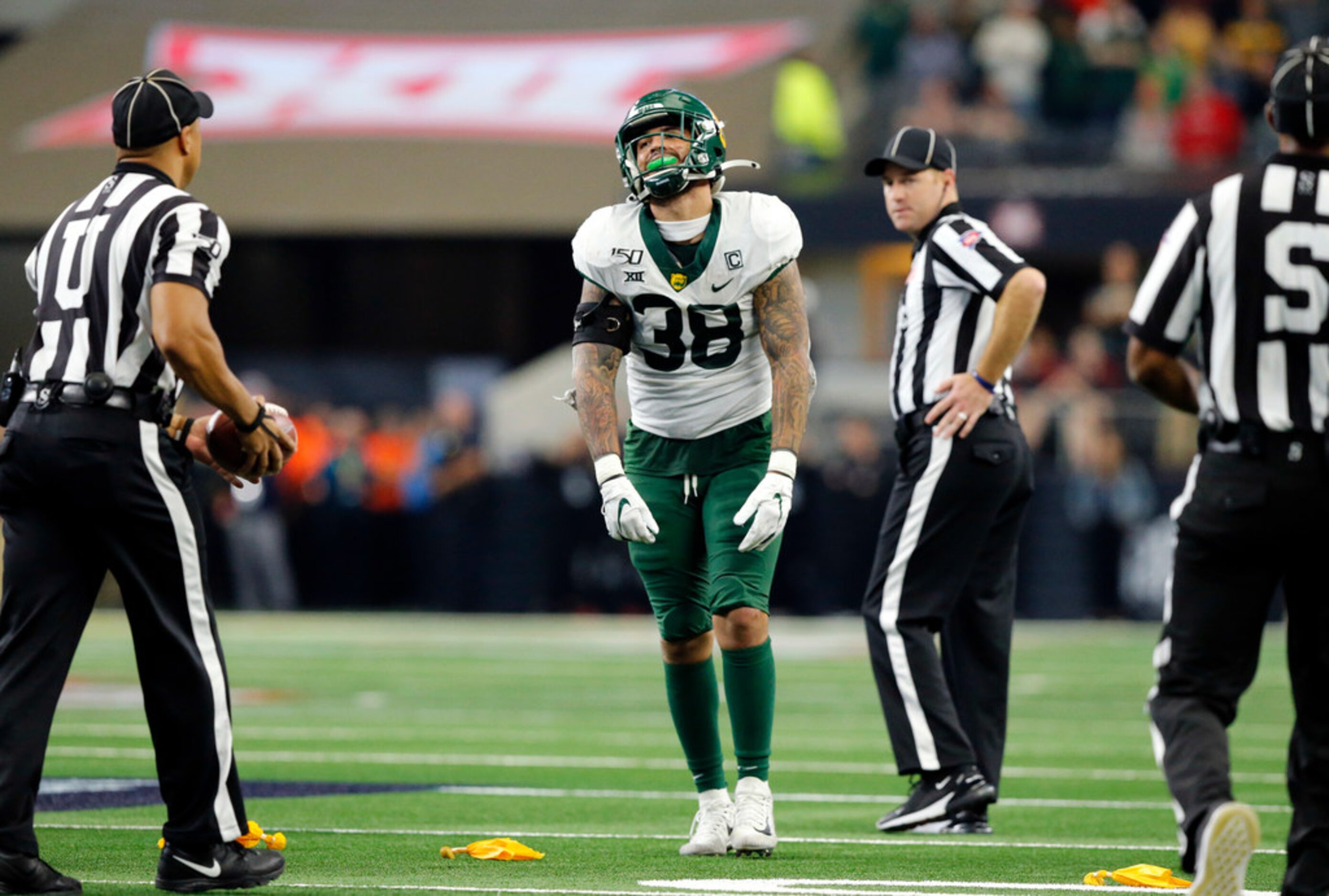 Baylor Bears linebacker Jordan Williams (38) reacts after being called for a face mask in...