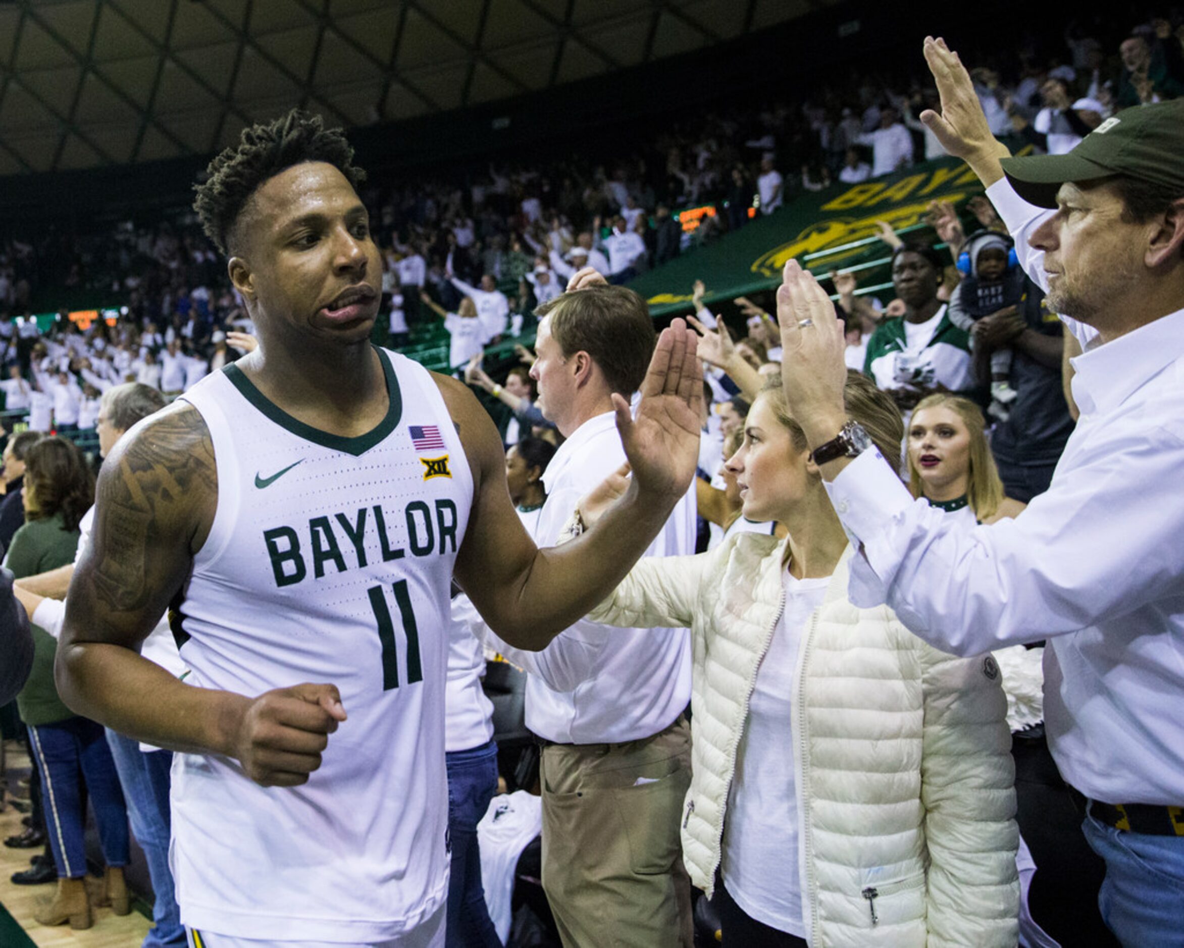 Baylor Bears guard Mark Vital (11) reacts to a 64-61 loss to Kansas Jayhawks after an NCAA...