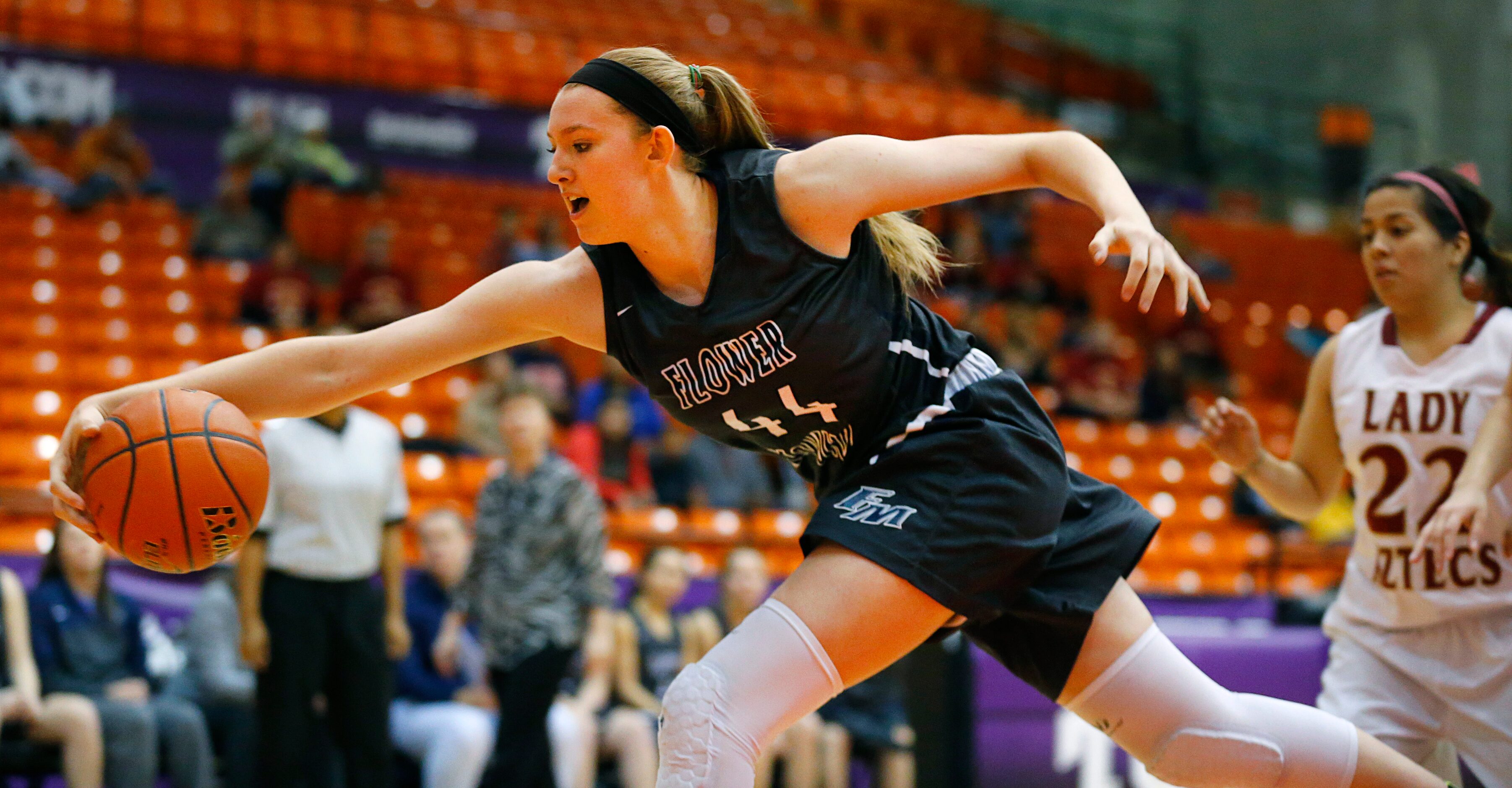 Flower Mound center Lauren Cox (44) tries to save the ball from going out of bounds against...