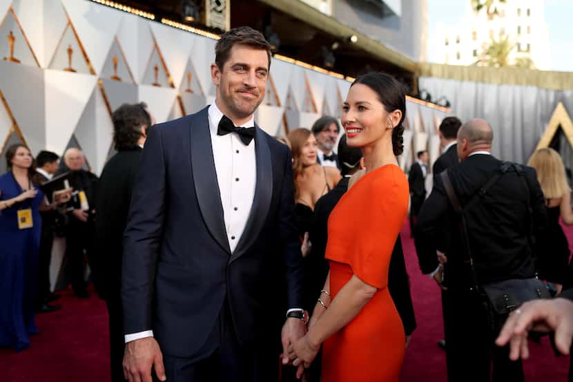HOLLYWOOD, CA - FEBRUARY 28:  Athlete  Aaron Rodgers (L) and actress Olivia Munn attend the...